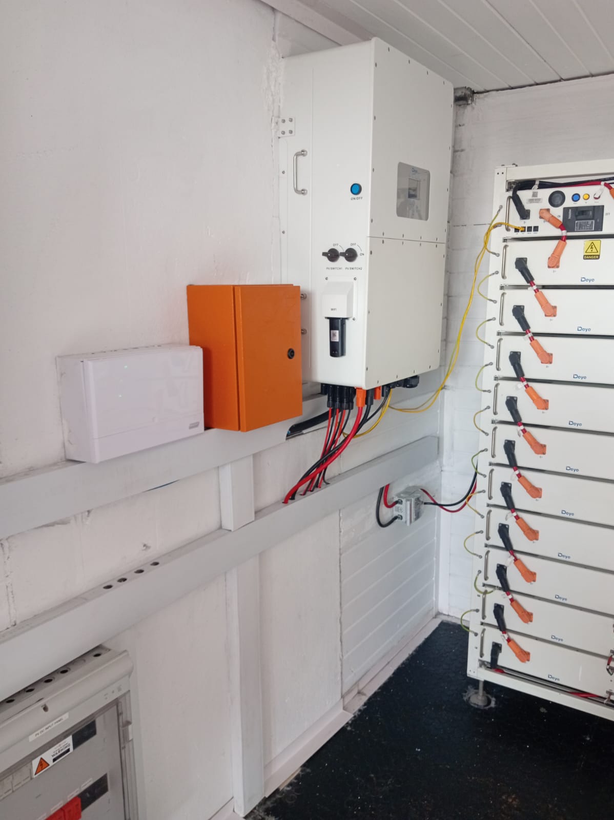 Full industrial Deye battery storage wall with 10-module lithium rack system and hybrid inverter